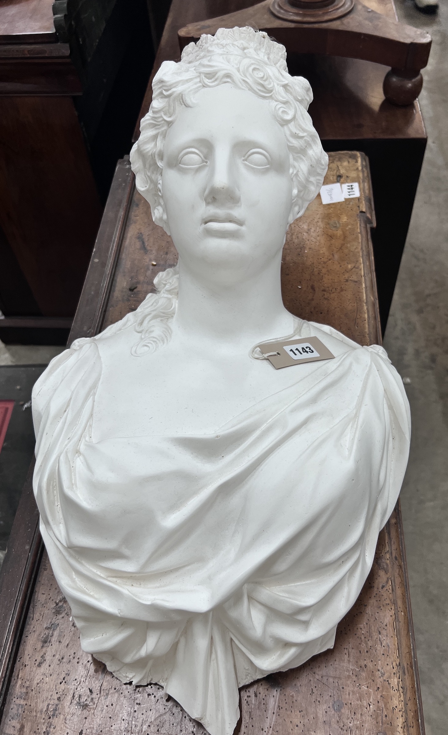 Two cast plaster wall applique busts, width 36cm, height 64cm
